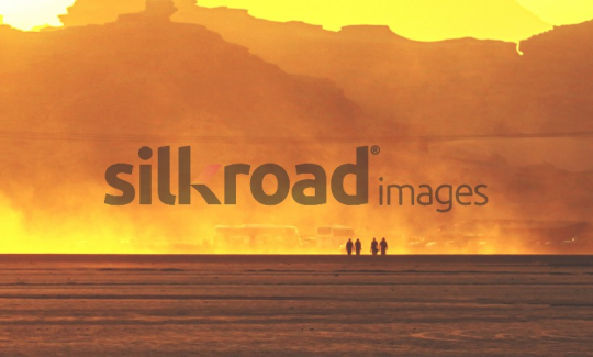 Sunset in Wadi Rum Desert, Jordan - Silhouettes of People Against the Golden Landscape
