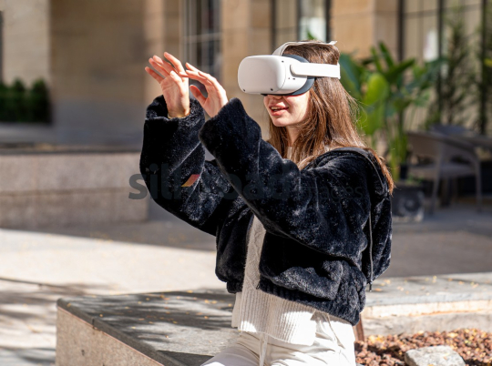 Woman Experiencing Virtual Reality Outdoors