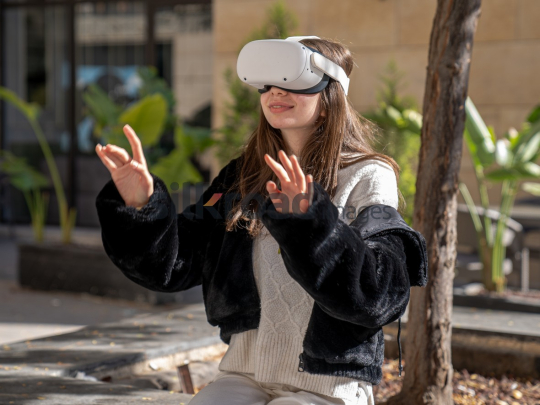 Woman Experiencing Virtual Reality Outdoors