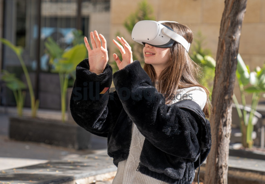 Woman Experiencing Virtual Reality Outdoors