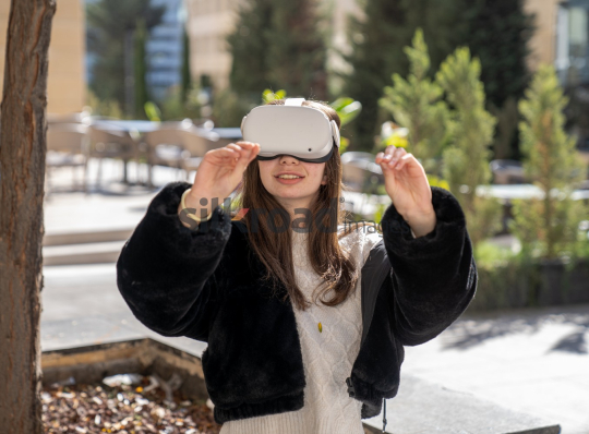 Woman Experiencing Virtual Reality Outdoors