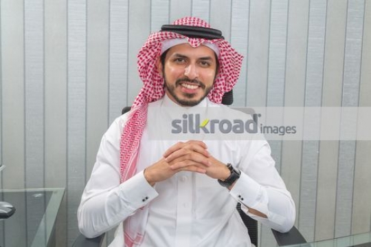 Businessman sitting at the office desk|
