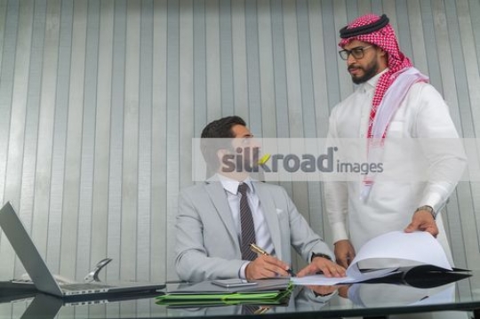Businessmen talking at the office|