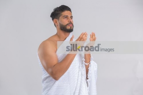 Arab man dressed in the white religious attire|