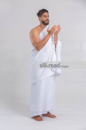 Middle Eastern man dressed in the traditional religious attire|